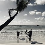 Surf group lesson ready to enter the water and practice in small waves in Tulum